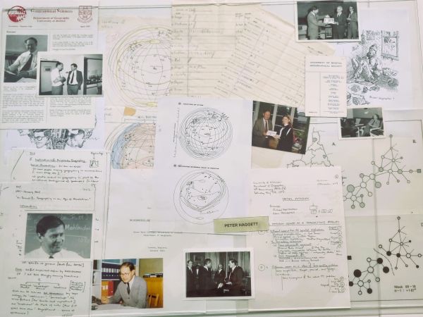 Flat lay of images, sketches, lecture notes