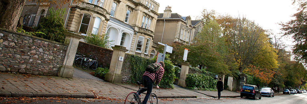 Cyclist on Woodland Road outside Arts Complex