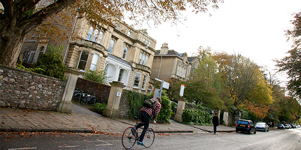 Cyclist on Woodland Road outside Arts Complex