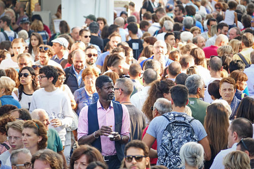 An image of lots of people in a crowded place
