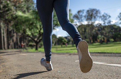 An image of a runner's legs and feet