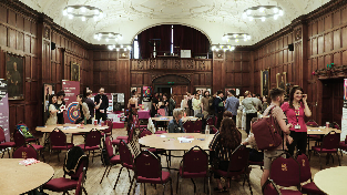 Image of people networking in library room in Wills Building