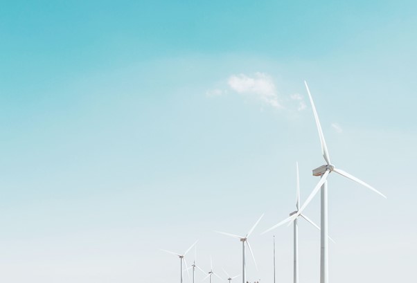 An image of a row of wind turbines