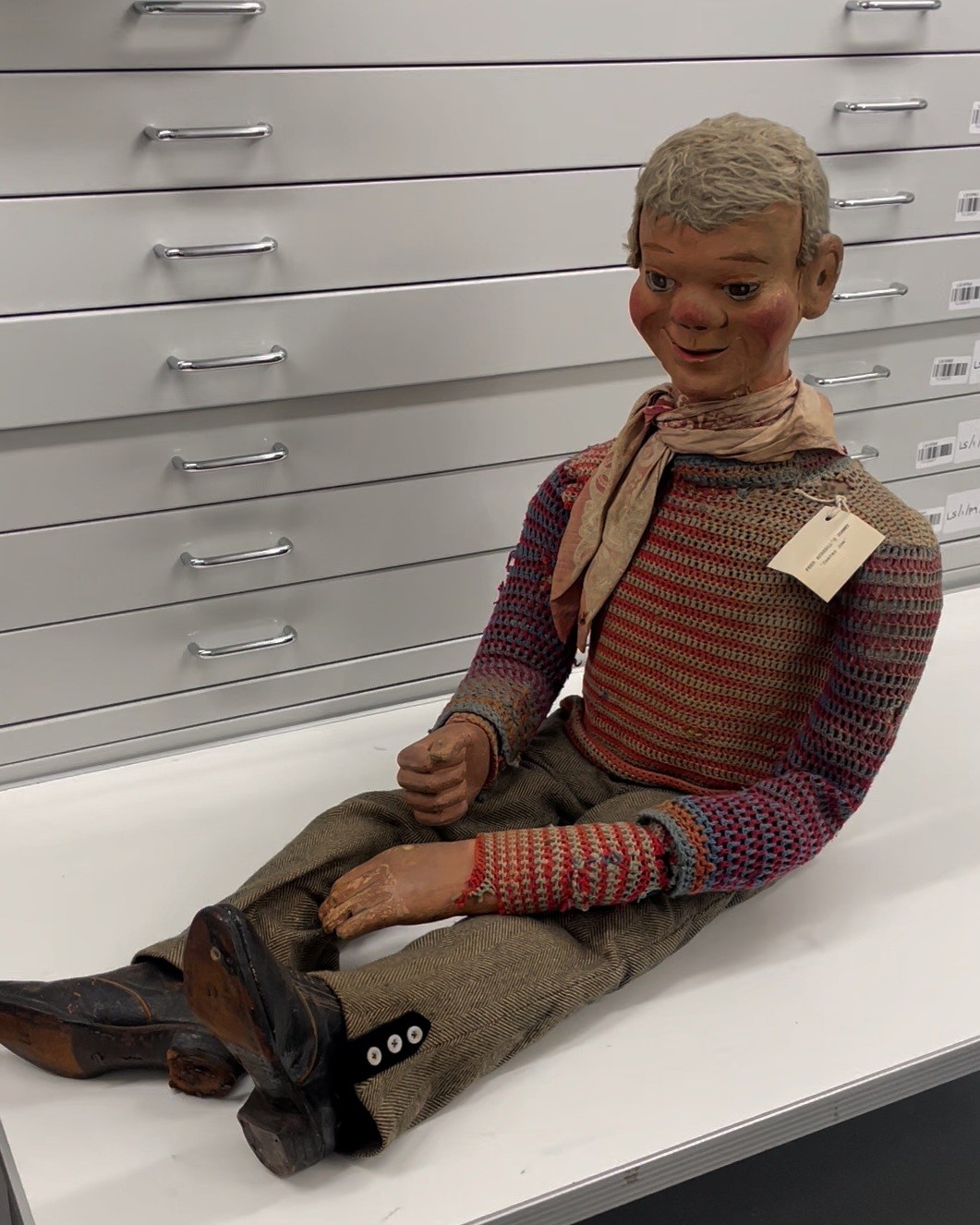 A ventriloquist dummy sitting on a table