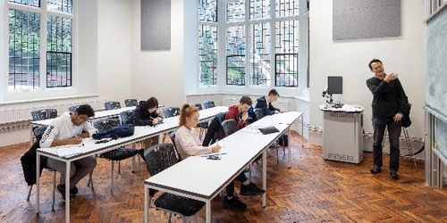 Students being taught in tutorial room