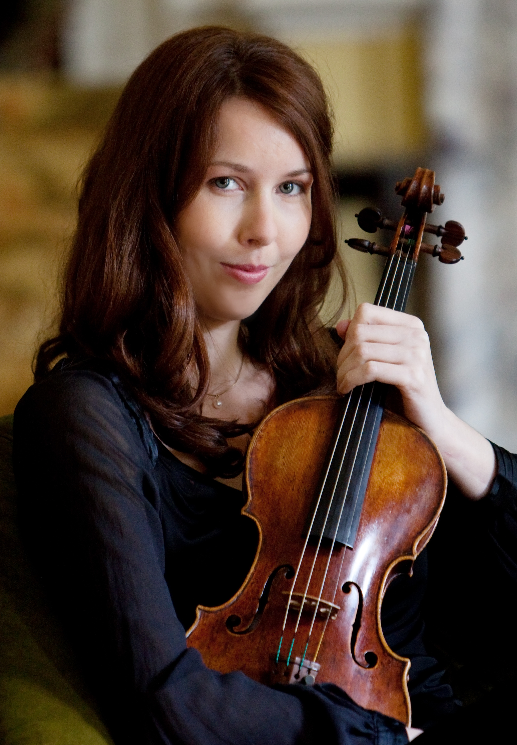 A woman holding a violin