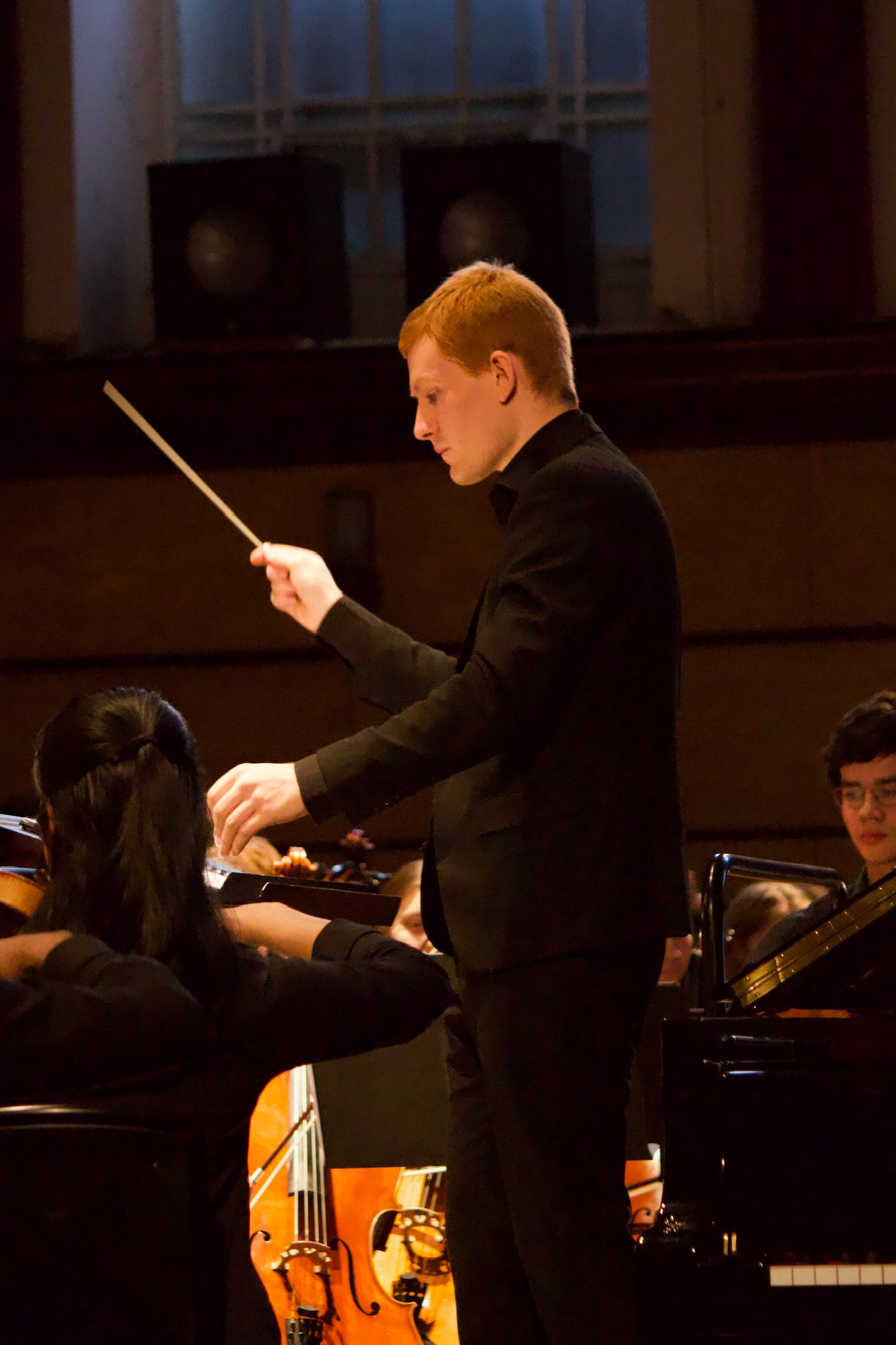 Caleb Kernaghan conducting a classical music ensemble
