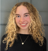 A young woman smiling at the camera