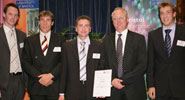 Second prize winners, StrainTrain (left to right): Robbie McLeod, Martin Herbert, Tim Deans, Vice-Chancellor Eric Thomas, Ben Jackson