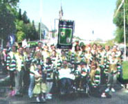 Children pose with gold waistcoats made by helpers at Lourdes