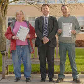 Dr Paul Watkins (centre) with Anne Cornish and Lionel Wheeler, the first two recipients of the NVQ level 3 in Animal Technology