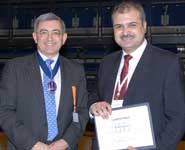 Dr Kafienah (right) receives his award from Dr Andrew Bamji, BSR President