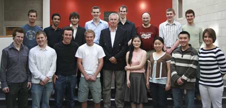 Professor David Blake (centre), with past and present students. Front row (l-r): Nick Simpson, Daniel Cornish, James Churchman, Jacob Vials, Siyuan Lu, Shirui Zhu, Junfeng Deng, Hayley Mitchell; back row (l-r): James Gwinnutt, Adi Gurtu, Alex McNeill, Adam King, Nicholas Hinitt, Robin Wickenden, John Harris, Amir Safavi