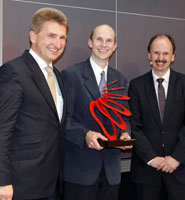 Dr Neil Fox (centre) receiving his award at E.ON’s headquarters in Düsseldorf.