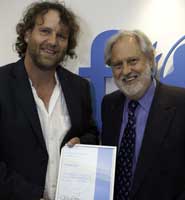 Dr Peter Blair receives his award from Lord Puttnam