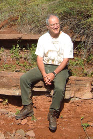 Professor Mike Benton sits on the Permian-Triassic boundary in the Korolki ravine, near Sol’Iletsk, southern Russia. This sandstone layer marks a major change in world climates that matched the biggest mass extinction ever, some 252 million years ago, when 95 per cent of all species died out.