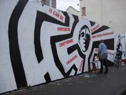 Putting the finishing touches to the mural on Jamaica Street, Stokes Croft