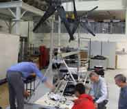 Staff and students assembling Bristol's wind turbine powered vehicle