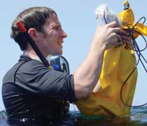 Dr Steve Simpson taking a recording of a reef in Southern Oman