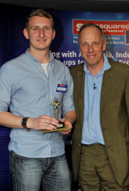 FoodCycle's Coordinator Adam Smith, left, receives the Best Social Enterprise Award from Simon Woodroffe