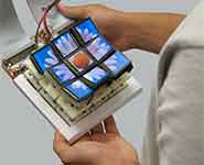 A user holding the portable Tilt Displays prototype