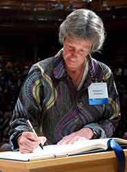 Professor Cashman signs the American Academy of Arts and Sciences’ Book of Members, a tradition that dates back to 1780