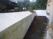 Before: the plain white wall outside Carlton Mansions