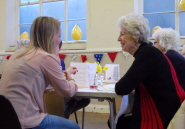 A student speaks to one of the guests at the annual dinner dance