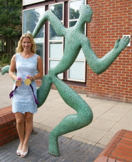 Laura with her medals outside the Sports Centre