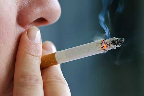 Image of someone smoking
