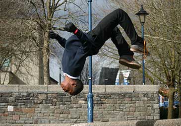 Youth performing back flip