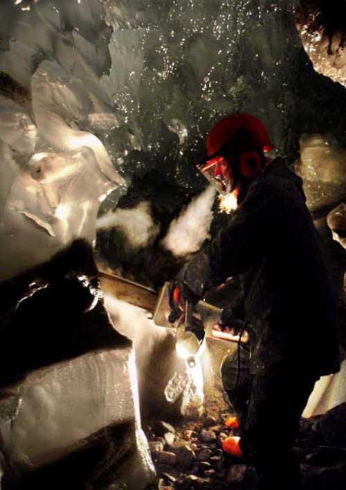 Image of Miriam Jackson sampling debris beneath another of the glaciers studied: Engabreen in Norway  