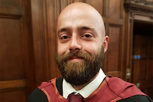 Callum Wallace in graduation gown