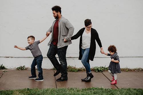 A family walking along the pavement