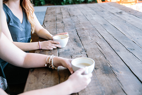 Young women chatting over a coffee