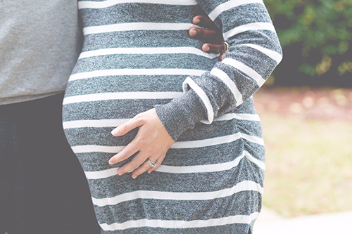 A pregnant woman with their partner