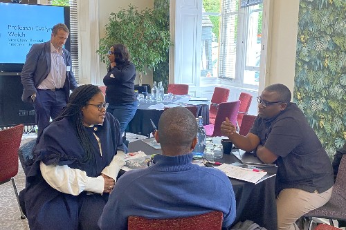 Image shows academics and senior leaders at the Breaking Barriers to Black Academia: High Quality Research event