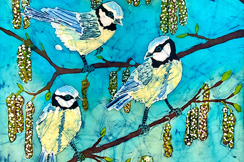 Trio of blue tits in batik