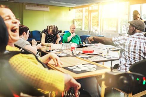 People with intellectual disabilities doing an art workshop