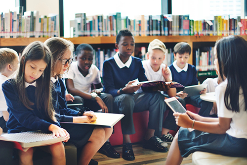 Schoolchildren in a library image by rawpixel.com