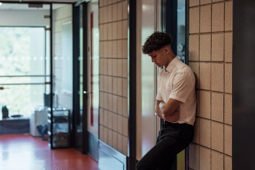 iStock image of a school child stood in a corridor