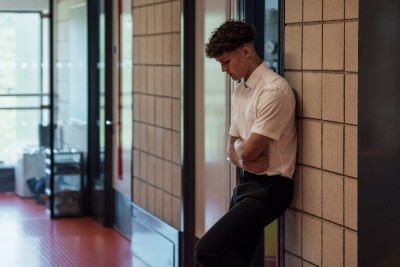 iStock image of a school child stood in a corridor