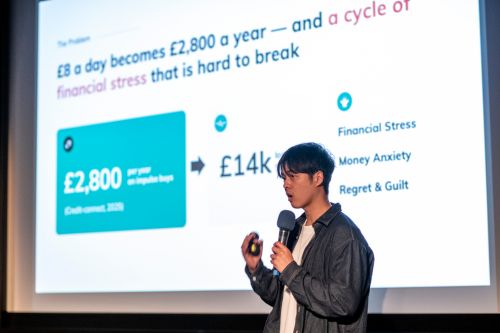 A student entrepreneur pitching their business idea on stage at the 2026 Runway Awards