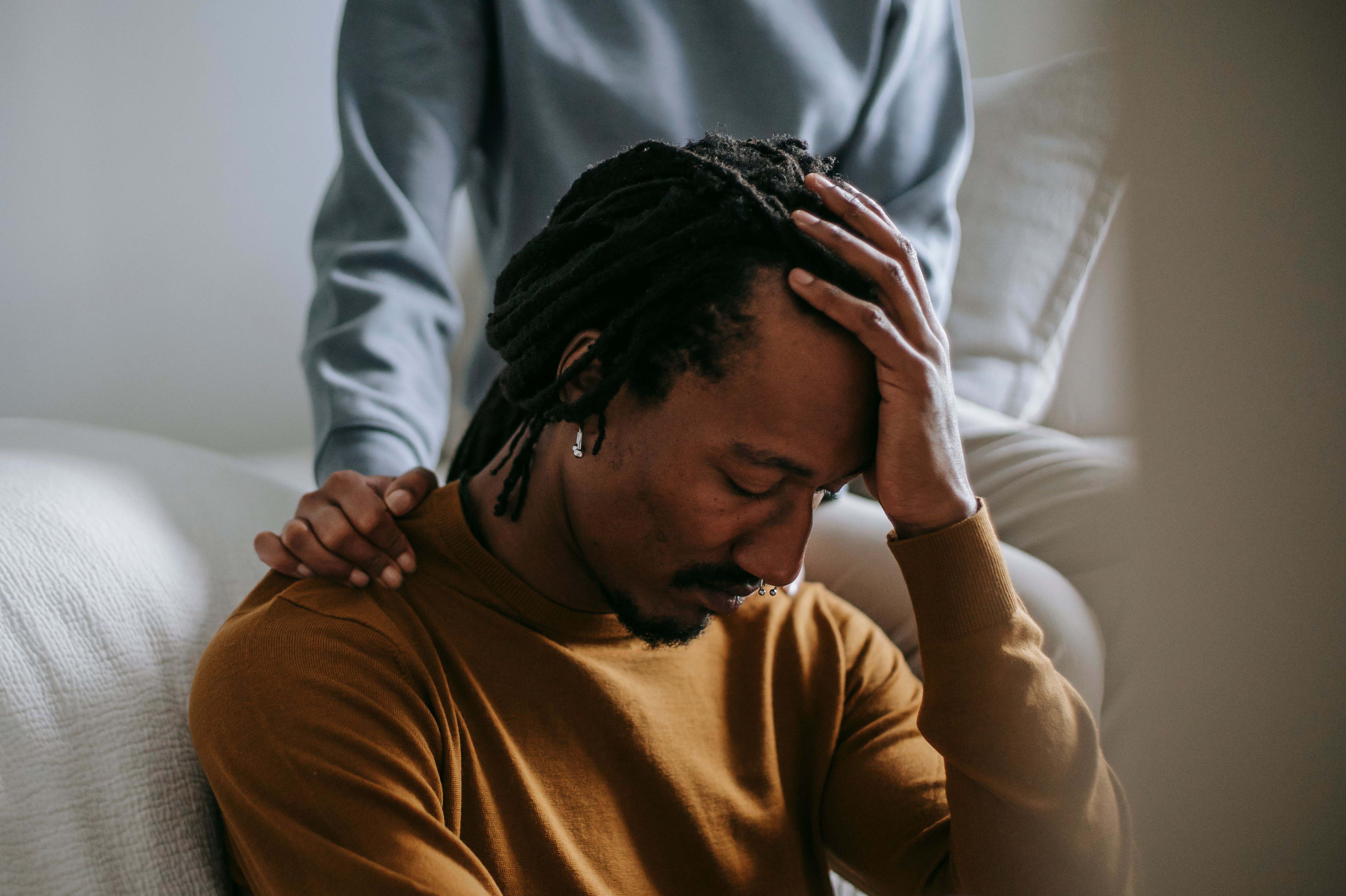 A thoughtful scene of emotional support between partners at home