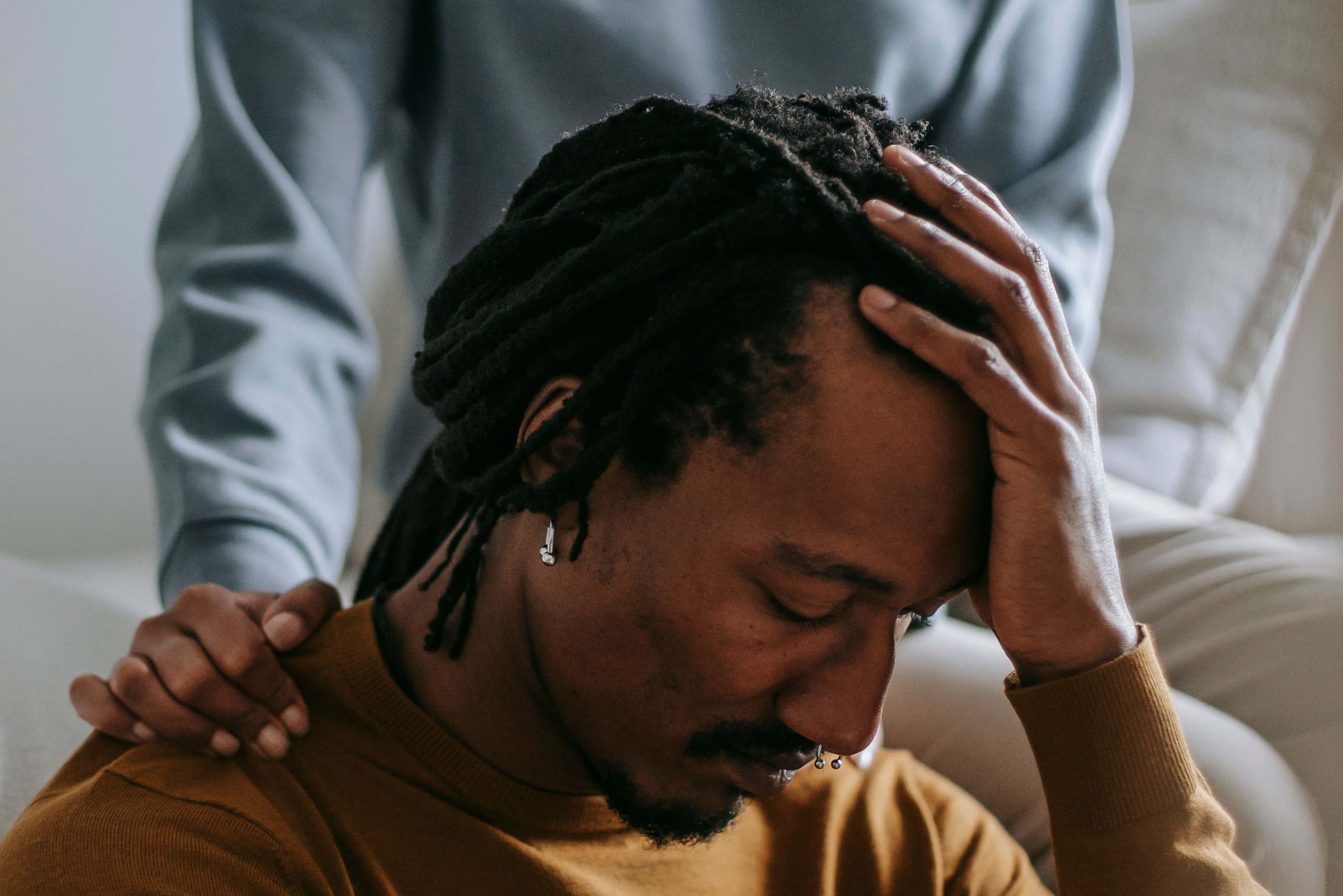 A thoughtful scene of emotional support between partners at home