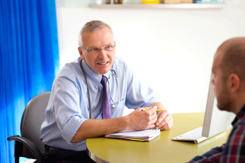 Generic image of a GP and patient in surgery.