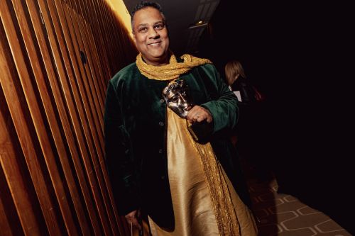 Photograph of Krish Majumdar with a BAFTA