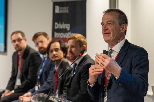 Professor Martin Kuball, Director and Project Lead at the University of Bristol (REWIRE), presenting to delegates gathered for the meeting