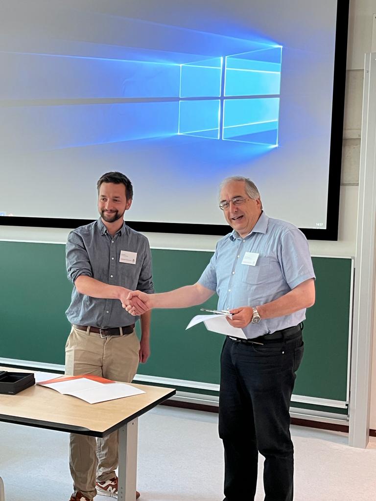 Dr Jake Ayres accepts the EMFL Prize.