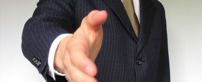 Business man offering handshake
